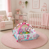 Children's play gym in a pink-themed nursery with crib, toys, and decor.